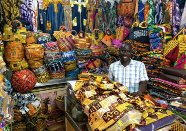 Cote d'Ivoire - Fabric Sellers in Market